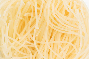 Intricate patterns of boiled noodles.