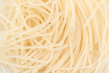 Intricate patterns of boiled noodles.