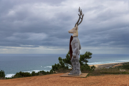 Nazar&eacute;, Portugal - October 18, 2022: Horizontal photo of the statue called 'Veado' overlooking the beach. It's made of marble, bronze, and steel and was created by Portuguese sculptor Ad&aacute;lia Alberto 