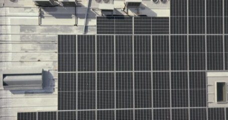 Solar energy, drone or roof construction engineering, architecture or energy sustainability. Aerial view, solar panels or industrial team working on project management, city logistics or innovation