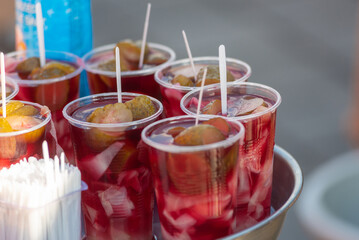 Glasses of fermented pickle juice for sale beside fish restaurants in Istanbul, the popular traditional Turkish drink is said to cure hangovers, Turkey.