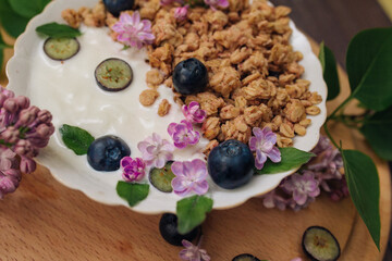 Granola - a dish for a healthy breakfast, as well as a traditional snack of rolled oatmeal, nuts and honey