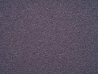 Violet, lilac dark felt, soft material blank texture. Surface of felted fabric texture abstract background. Pattern for text, lettering, patchwork or other art work. Full frame backdrop wallpaper.