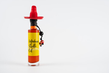  bottle of medium chilli infused oil isolated on a white background