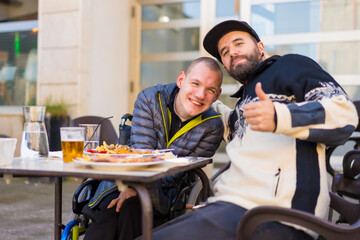 Selfie and portrait of friends eating in a restaurant terrace, disabled person eating