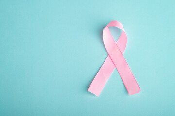 pink ribbon breast cancer on blue background