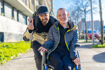 Portrait of a disabled person in a wheelchair with a friend, normality of disabled people