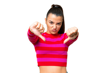 Young beauty woman over isolated chroma key background showing thumb down with two hands