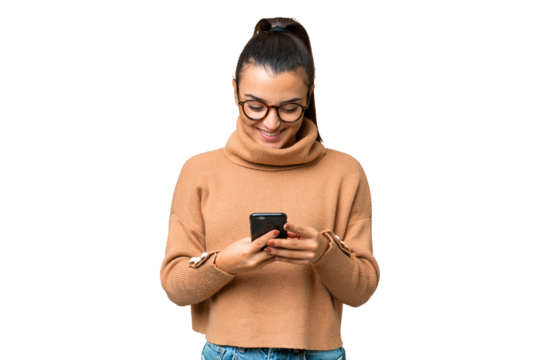 Young beauty woman over isolated chroma key background sending a message with the mobile