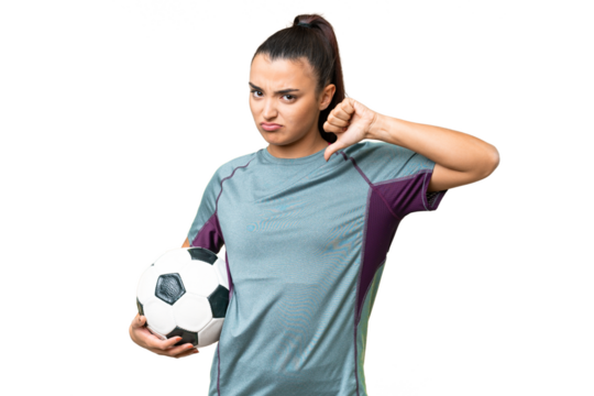 Young football player Woman over isolated chroma key background showing thumb down with negative expression