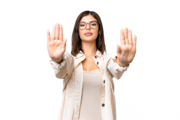 Young Russian woman over isolated chroma key background making stop gesture and disappointed