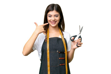 Seamstress woman over isolated chroma key background giving a thumbs up gesture