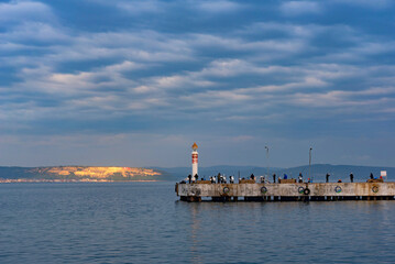 Fototapeta premium Stunning scenic panorama of the pier in the port city of Canakkale looking towards the Dardanelles and Gallipoli Peninsular, western Turkish coastline. .