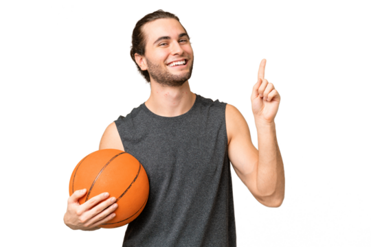 Young basketball player man over isolated background pointing up a great idea