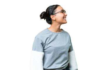 Young Uruguayan woman over isolated chroma key background laughing in lateral position