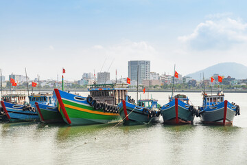 Fototapeta na wymiar Scenic view of traditional fishing boats on Han River, Da Nang, Vietnam