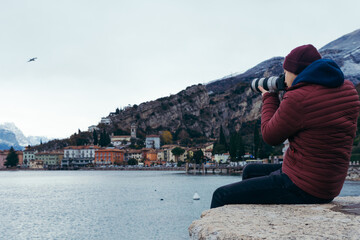 Fototapeta na wymiar A photographer looks around the vicinity of Lake Garda