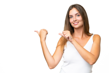 Young pretty woman over isolated background pointing to the side to present a product