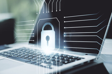 Double exposure of creative lock hologram with chip on laptop background. Information security concept