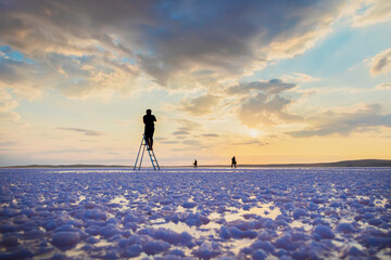 Fototapeta na wymiar silhouette of a person walking on the snow