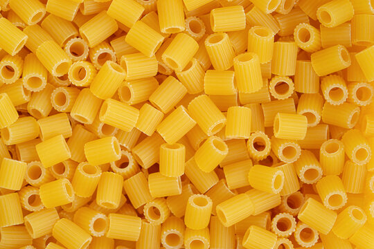 Italian pasta ditali rigati background. Top view, close up.