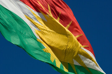 the Kurdish flag of the Kurdish region of northern Iraq, symbolic of independence for the Kurds of the Middle East  - obrazy, fototapety, plakaty