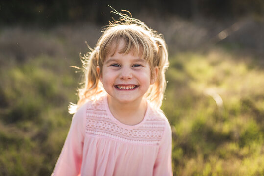 Portrait of young girl smiling at camera