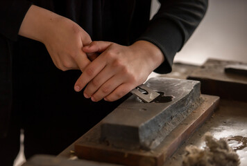 close up of hand holding a pen