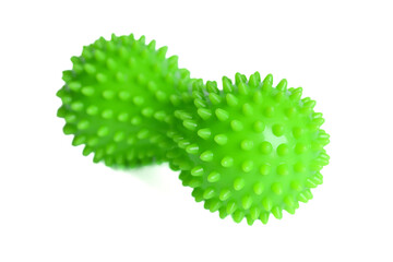 Green double or peanut spiky ball massager for yoga pilates or stretching and fascia pain. Sports equipment for fitness isolated on a white background. Concept of sports massage.
