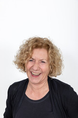 attractive laughing mature woman with curly hair