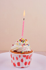 Birthday candle in cupcake