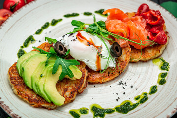 Potatoes pancakes, Hash brown. Hashbrown with feta cheese, salted salmon and chopped avocado.