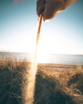 Sand pouring from hand