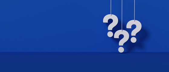 Three white question marks a blue wall background. © ImagesRouges