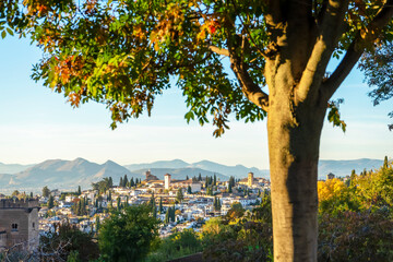 Naklejka premium Sunset over ancieat arabic Alhambra in Granada, Spain on November 26, 2022 