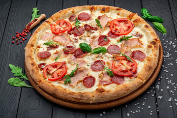 Pizza with mozzarella cheese, salami and chicken meat