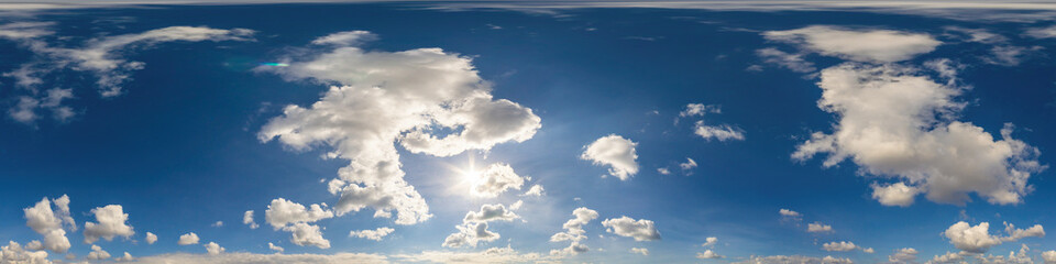 Blue sky panorama with puffy Cumulus clouds. Seamless hdr pano in spherical equirectangular format. Sky dome or zenith for 3D visualization, game and sky replacement for aerial drone 360 panoramas.