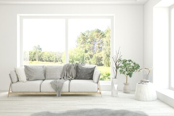 White living room with sofa and summer landscape in window. Scandinavian interior design. 3D illustration