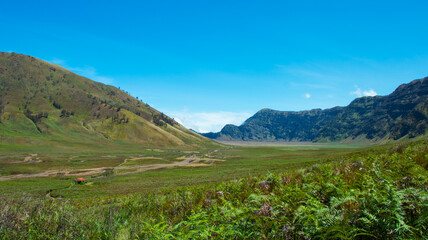 Fototapeta premium Savana and Teletubbies Hill at Bromo Tengger Semeru National Park, East Java, Indonesia. Indonesian Landscape