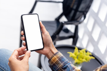 cell phone blank white screen mockup.hand holding texting using mobile on desk at office.background empty space for advertise.work people contact marketing business,technology