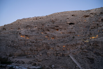 The tradition of lighting candles in front of the Mer Saba Monastery in the Yehuda Desert