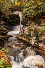 An Autumn view of Adams Falls, one of the 22 named falls in Ricketts Glen State Park located in Columbia, Luzerne, and Sullivan counties in PA.