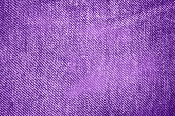 Texture of purple jeans. Denim. 