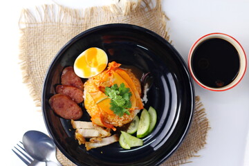 Barbecued red pork in sauce with rice served in the restaurant. There are many sold in Thailand.Barbecued red pork in sauce with rice is a popular food in Thailand.flat lay, top view.
