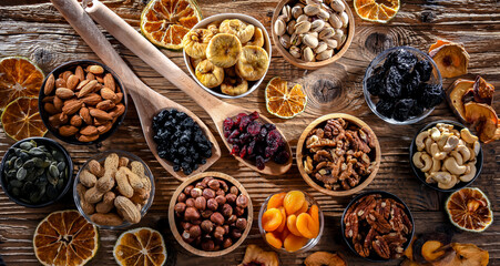 Composition with a variety of dried fruits and assorted nuts.
