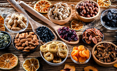 Composition with a variety of dried fruits and assorted nuts.