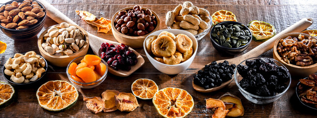 Composition with a variety of dried fruits and assorted nuts.