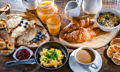 Breakfast served with coffee, eggs, cereals nd croissants