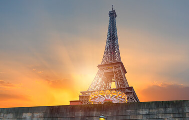 Eiffel tower with carousel at amazing sunset - Paris, France