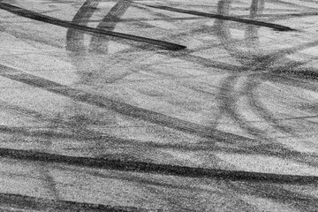 Tire track mark on asphalt tarmac road race track texture and background, Abstract background black...